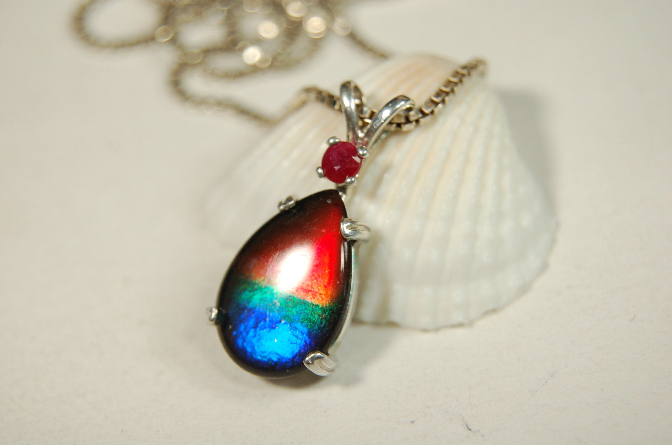 Ammolite Raibow pendant.Natural ruby companion stone.Lots of bright colors.#110317