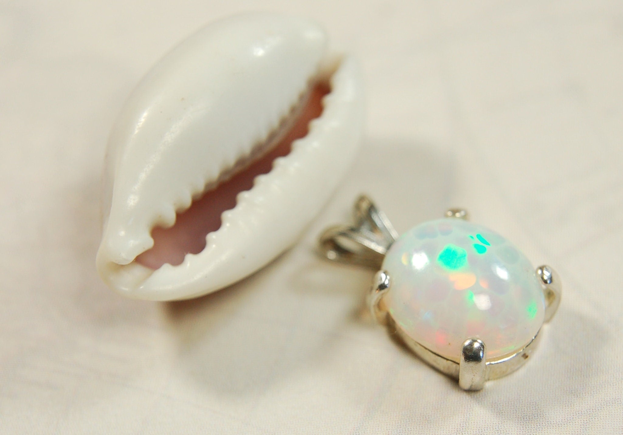 Opal pendant.Bright rolling colors. Desirable honeycomb gemstone.Perfect gift for her.MUST see colors in video.121213
