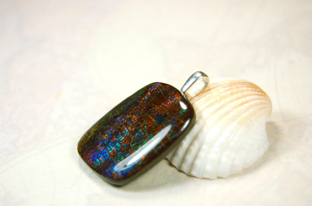 Ammolite Pendant Necklace.RARE Natural gem with brilliant sparks of color on black background.--071815