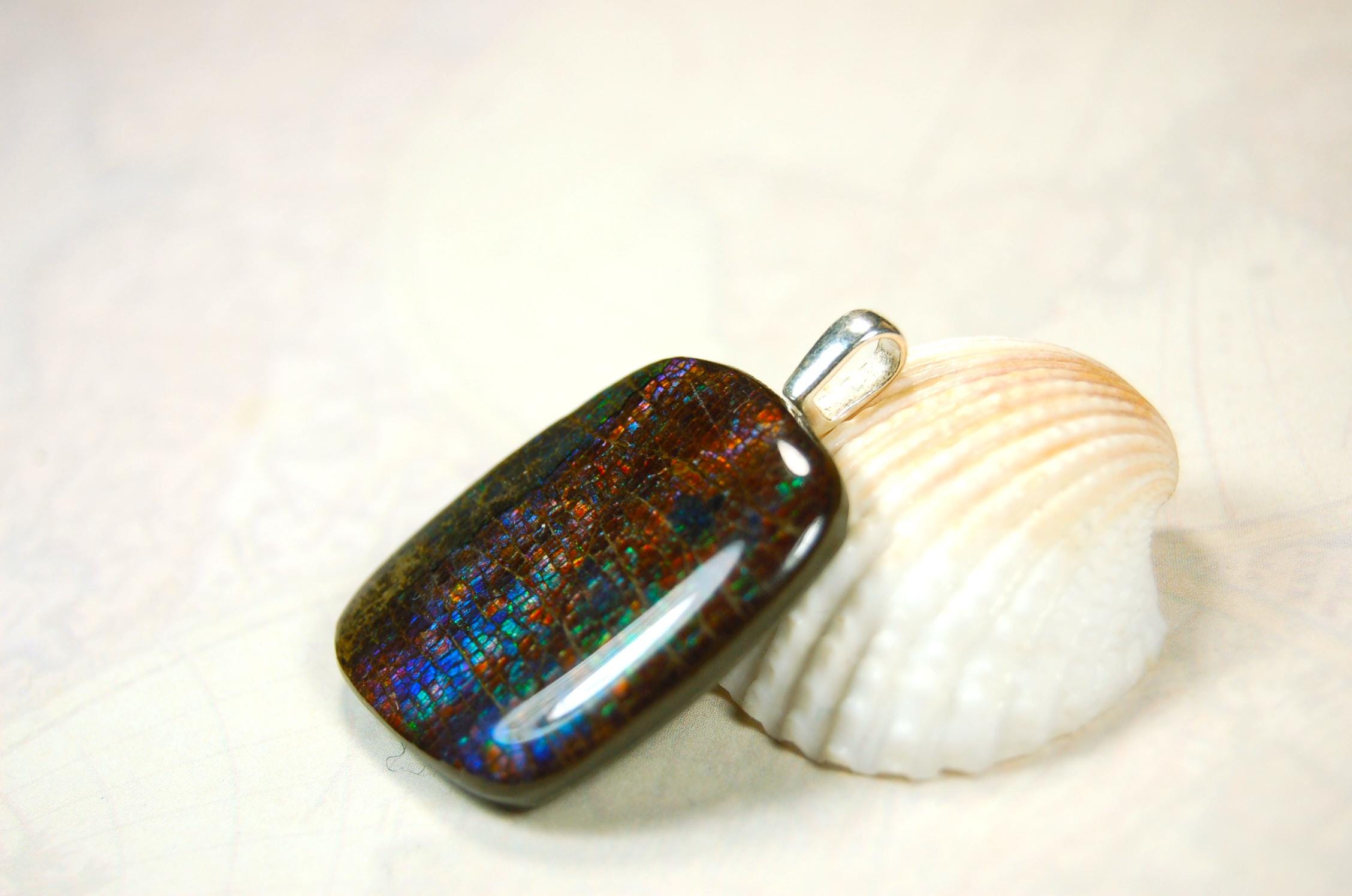 Ammolite Pendant Necklace.RARE Natural gem with brilliant sparks of color on black background.--071815