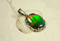 Ammolite Pendant elegantly set in sterling silver.Lovely greens and blues and flash of red.Fine anniversary gift idea for  wife.041916