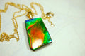 Ammolite pendant.Vivid colors in a high quality all natural cabochon with 14k gold filled bail.Fine fashion jewelry accessory 022516