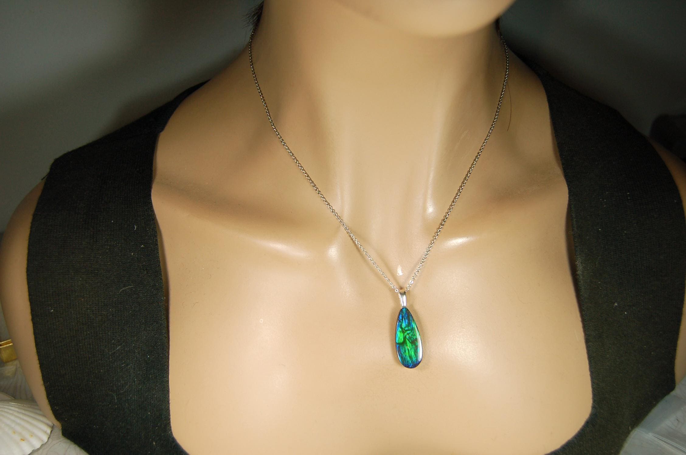 Ammolite Jewelry Pendant.All natural high quality cabochon from Alberta Canada.070715