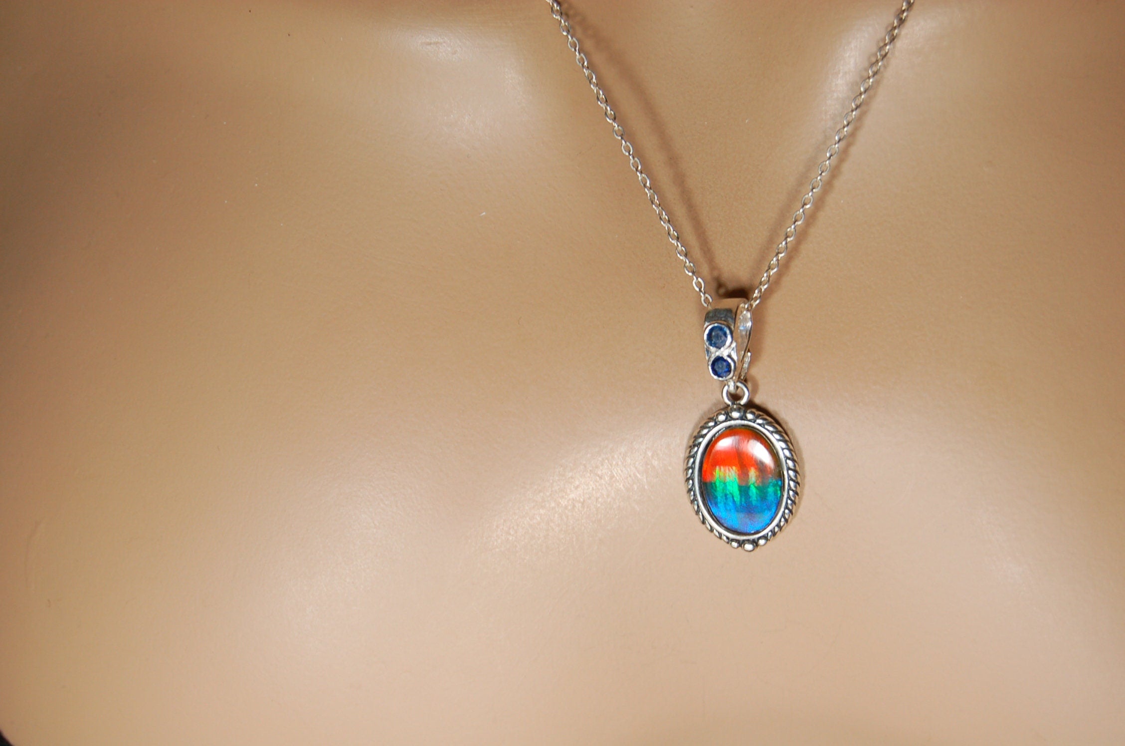 Ammolite Pendant Necklace.Solid sterling silver setting.Bright Rainbow colors. Sapphire studded bail.Unique gift for wife.102429