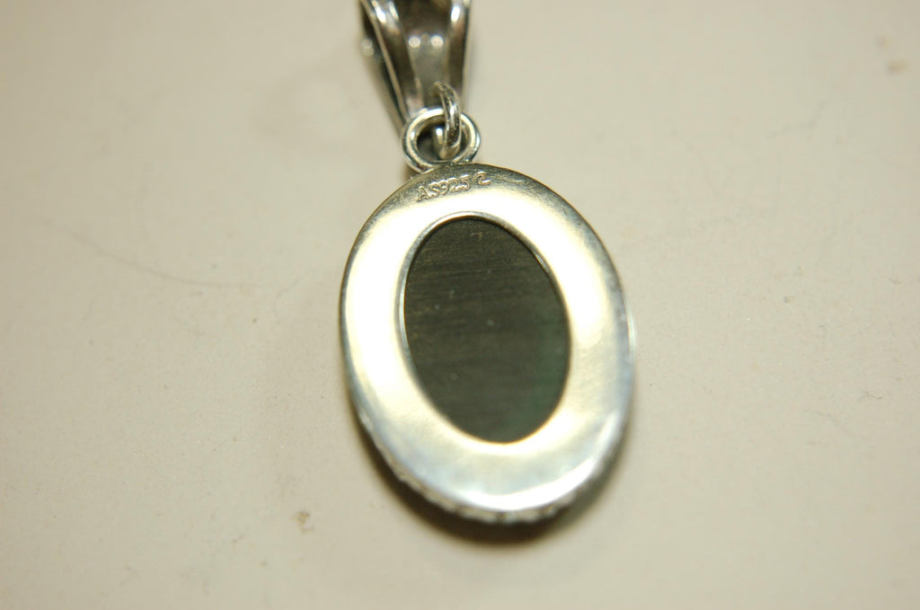 Ammolite Pendant Necklace.Resembles a fiery coal.Strong color shifter.Duty free under CUSMA rules.022115