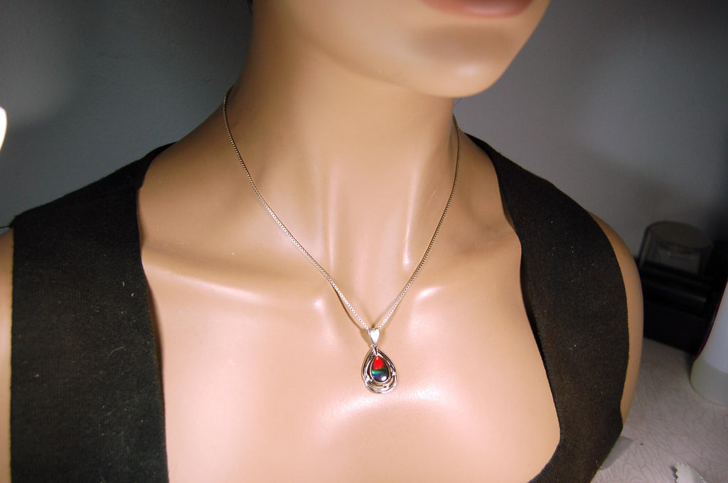 Eye-Catching Ammolite Pendant gift for Mothers Day she will treasure.Genuine Ammolite mined, finished and shipped from Canada 032015