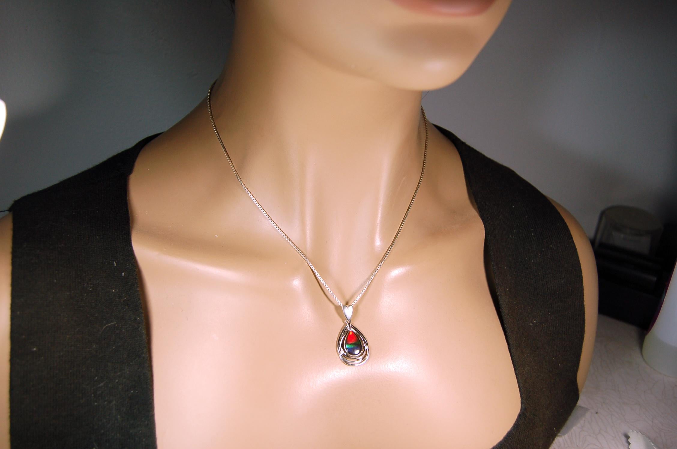 Eye-Catching Ammolite Pendant gift for Mothers Day she will treasure.Genuine Ammolite mined, finished and shipped from Canada 032015