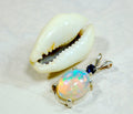 Natural opal pendant with blue sapphire.Good quality with many colors.The perfect gift.Must see video for true colors.042114