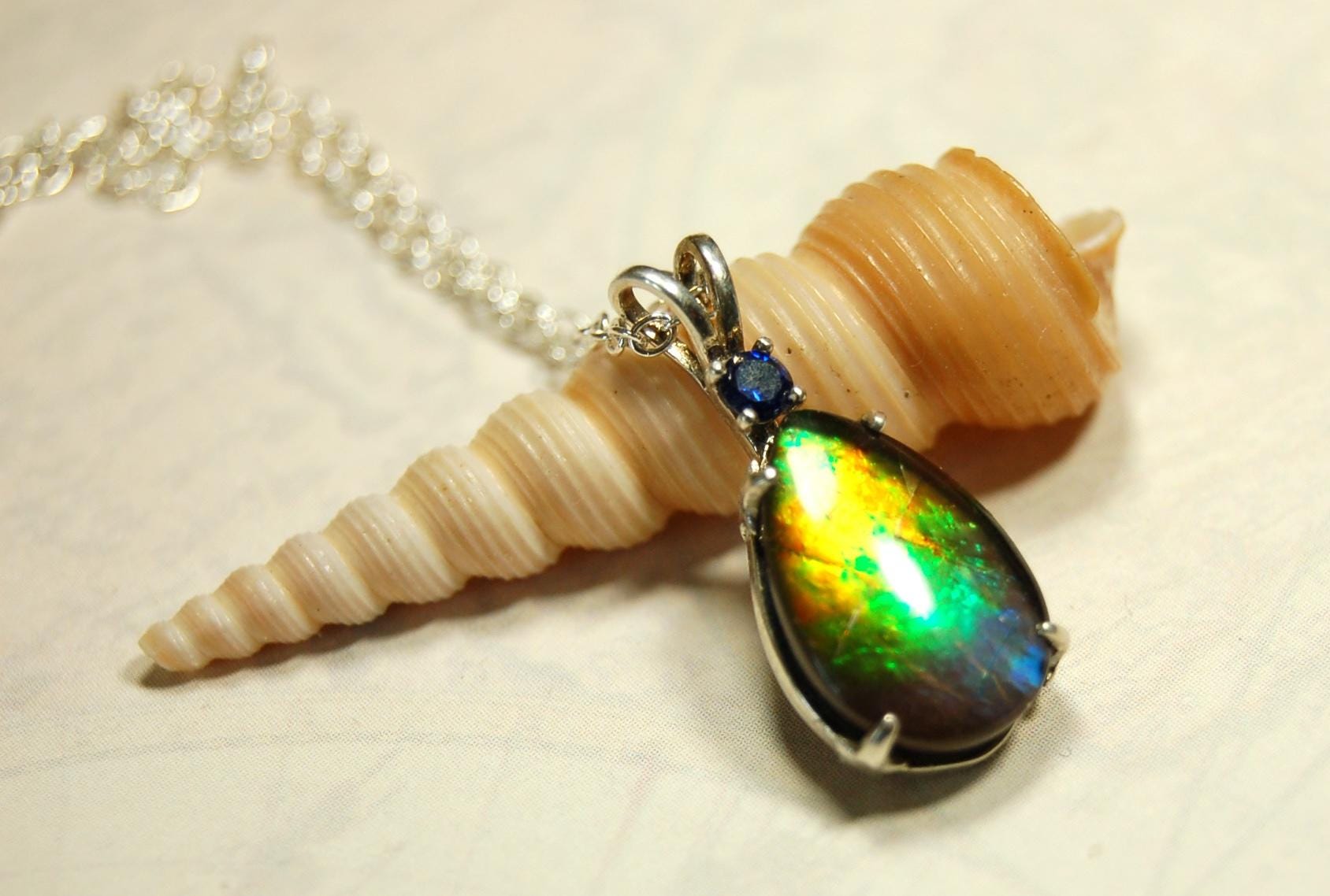Sterling Silver set Ammolite Pendant with blue Sapphire.A gift idea for your wife she will treasure..060916