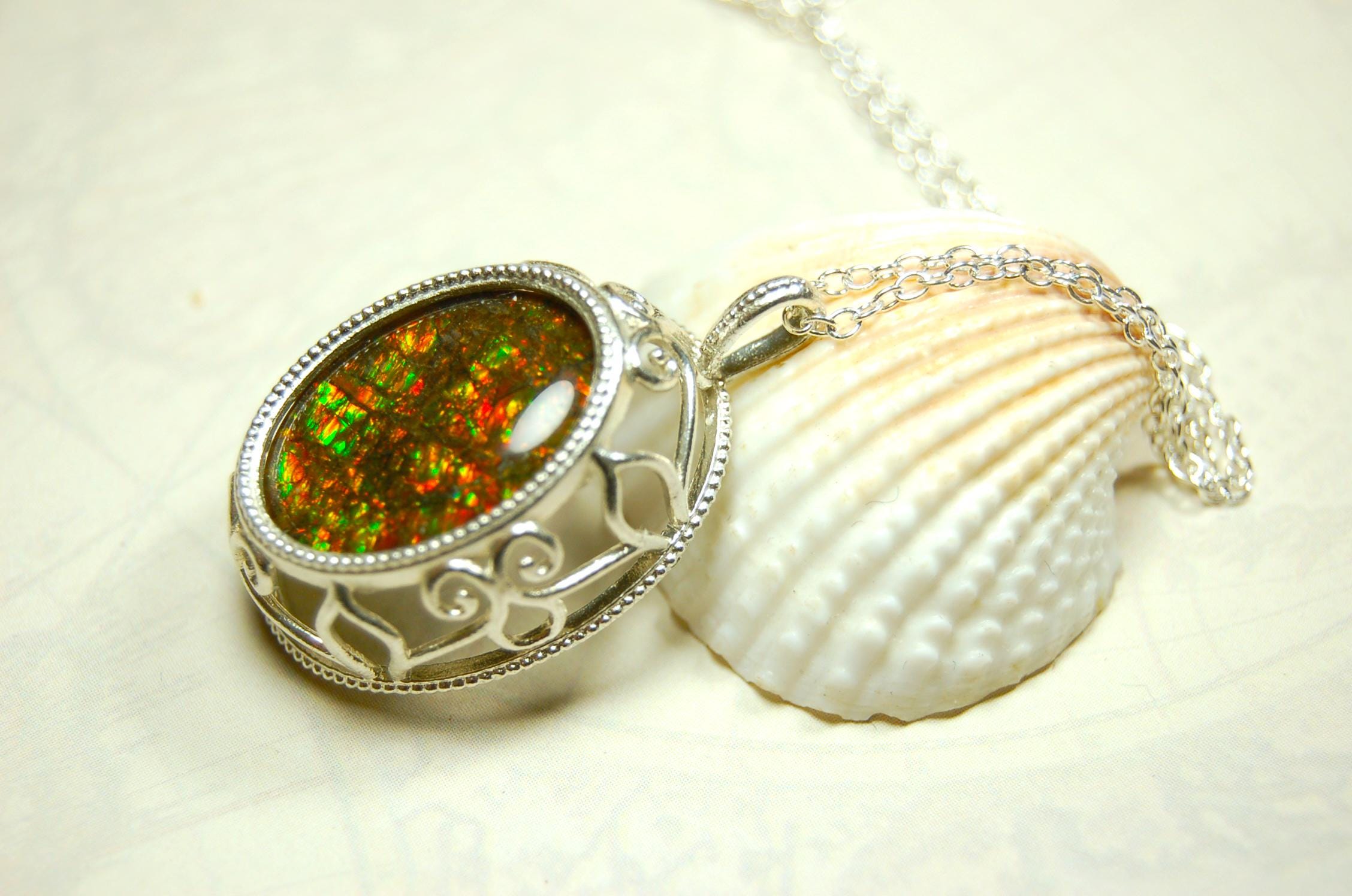 Unusual Ammolite pendant full of multicolor sparkles.A gift that will be treasured..032116