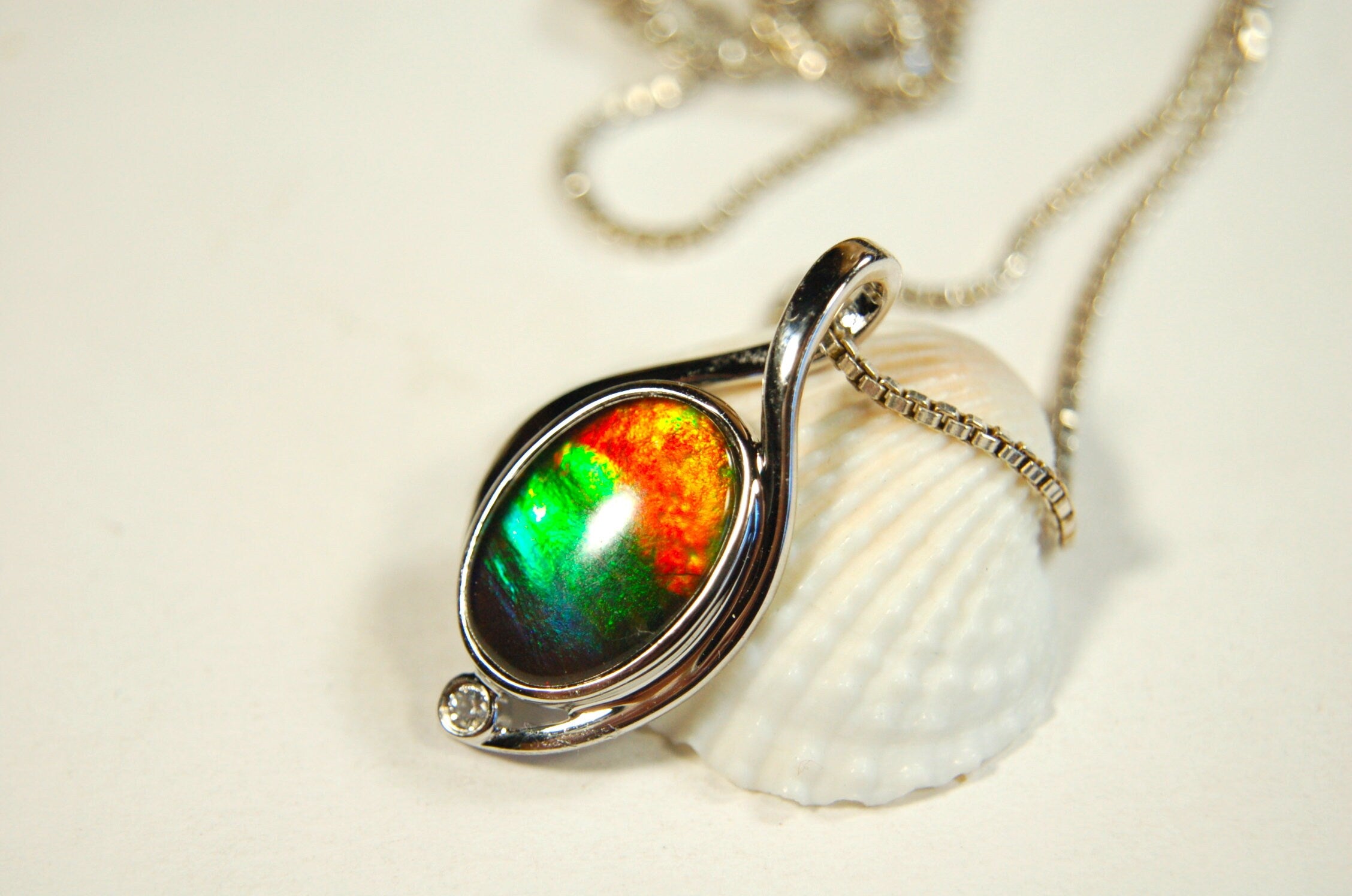 Ammolite Jewelry Pendant.Strong colors.Quality sterling Allergy free silver setting.Shipped free.071612