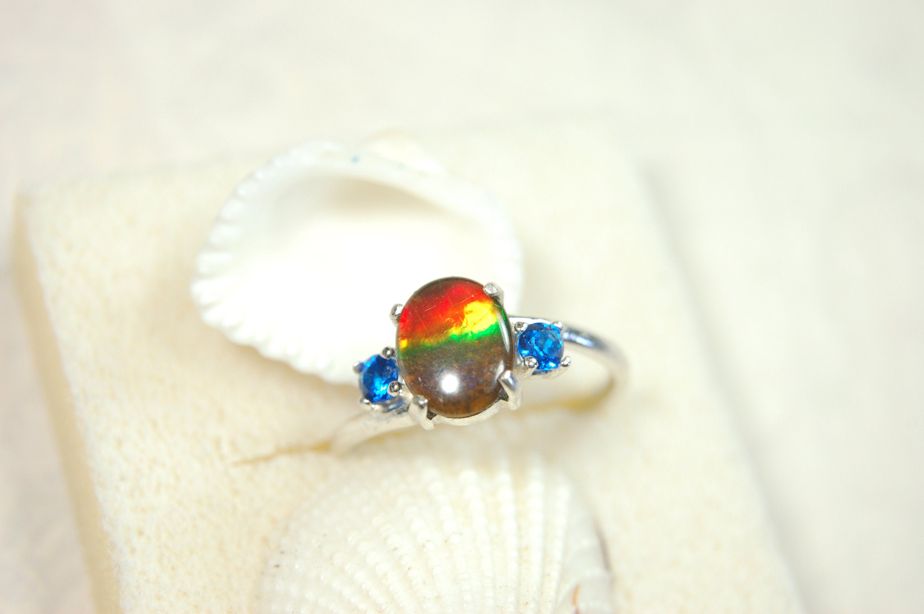 Ammolite Ring with brilliant Spinel side stones.Size 7.