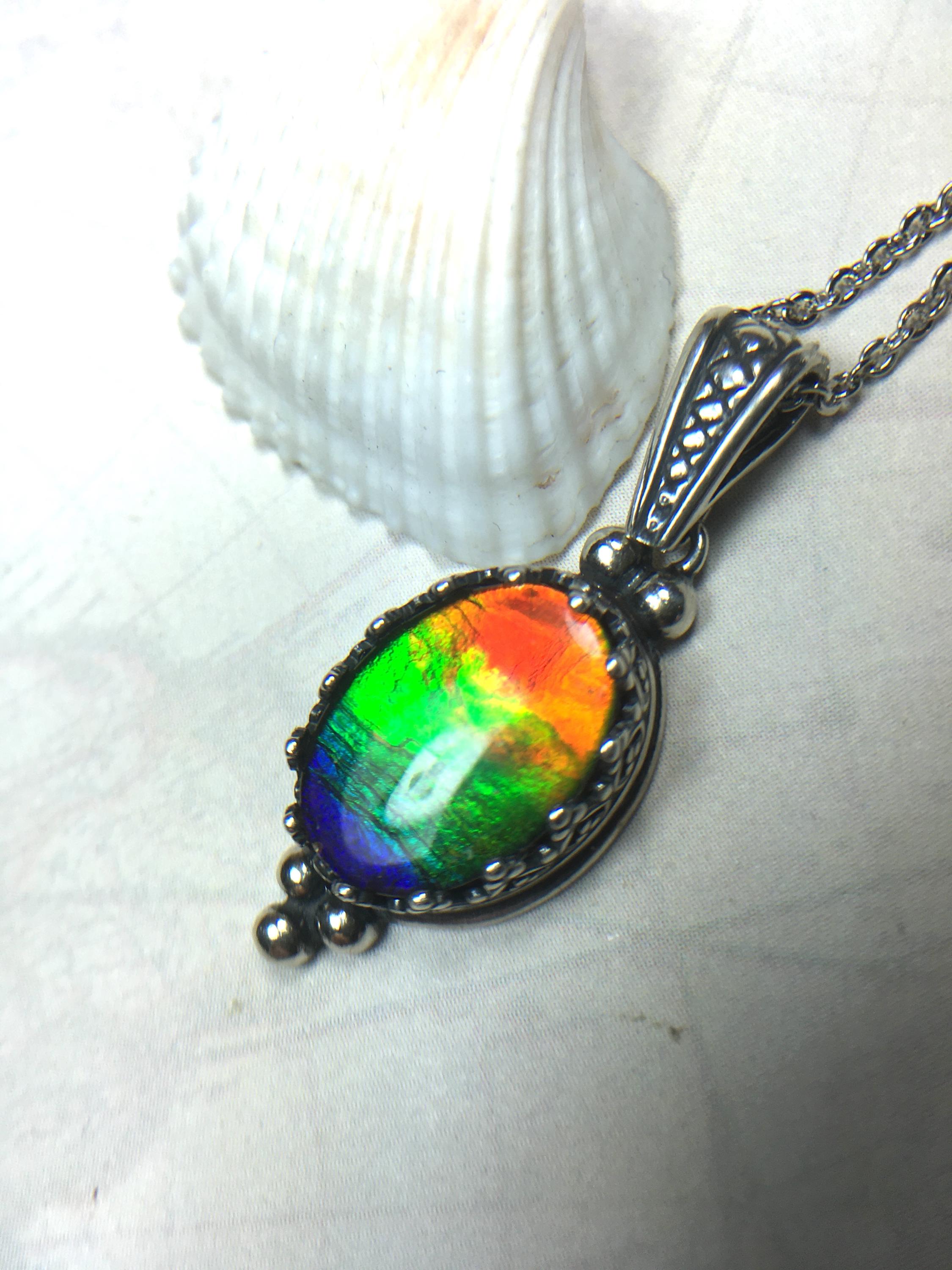 Genuine Ammolite Jewelry Pendant.Rainbow gem.Sterling Silver setting.No import taxes under CUSMA rules.062815