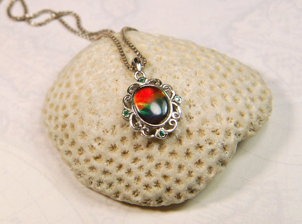 Ammolite Jewelry Pendant.Certified Authentic Canadian gem.White Gold Fill over Sterling silver setting.120213