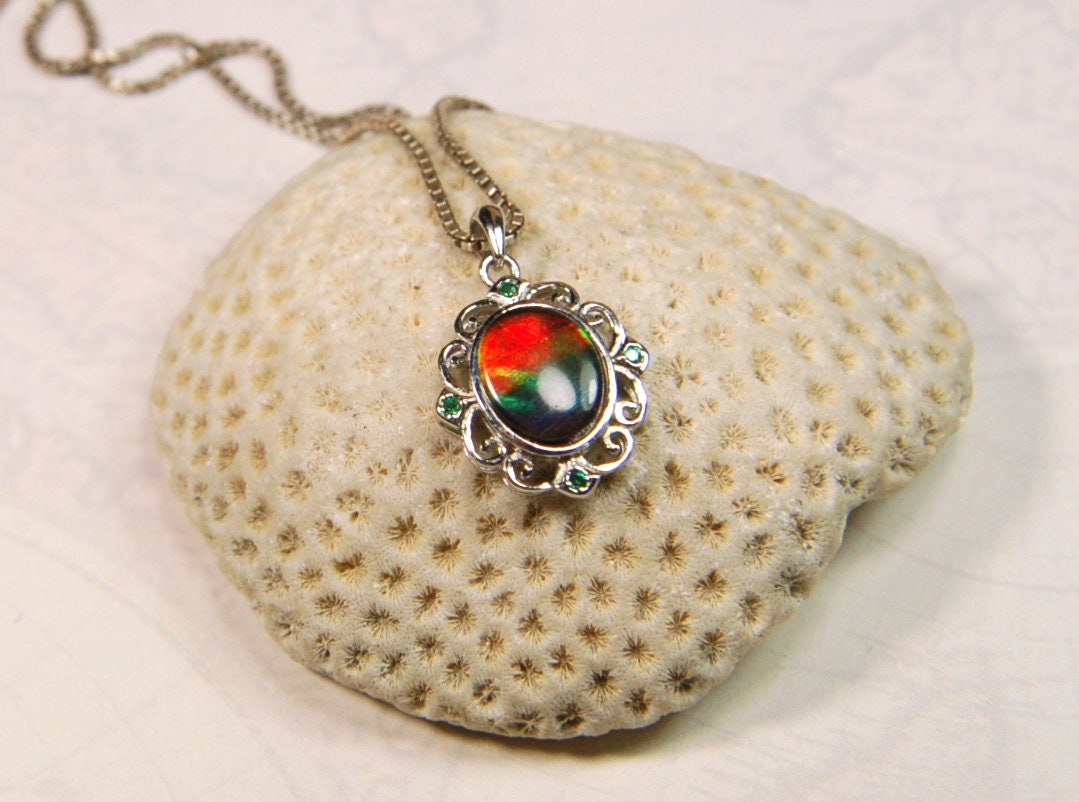 Ammolite Jewelry Pendant.Certified Authentic Canadian gem.White Gold Fill over Sterling silver setting.120213