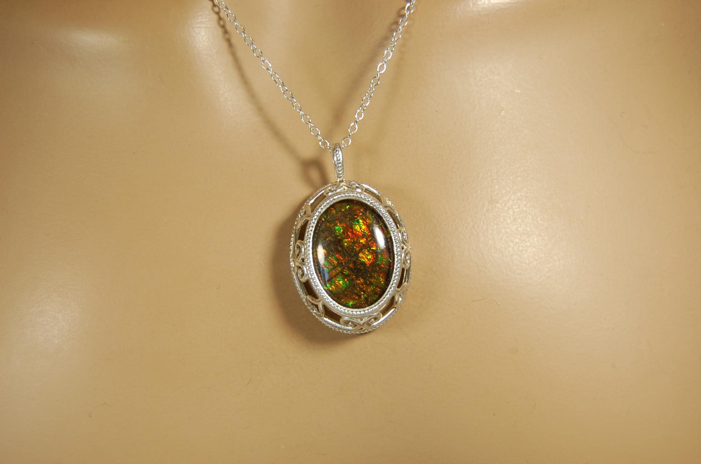 Unusual Ammolite pendant full of multicolor sparkles.A gift that will be treasured..032116