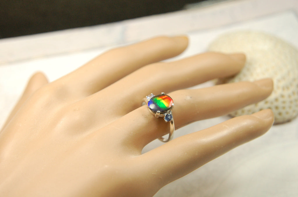 Ammolite Ring with brilliant colors and Tanzanite side stones.Size 7 #120223