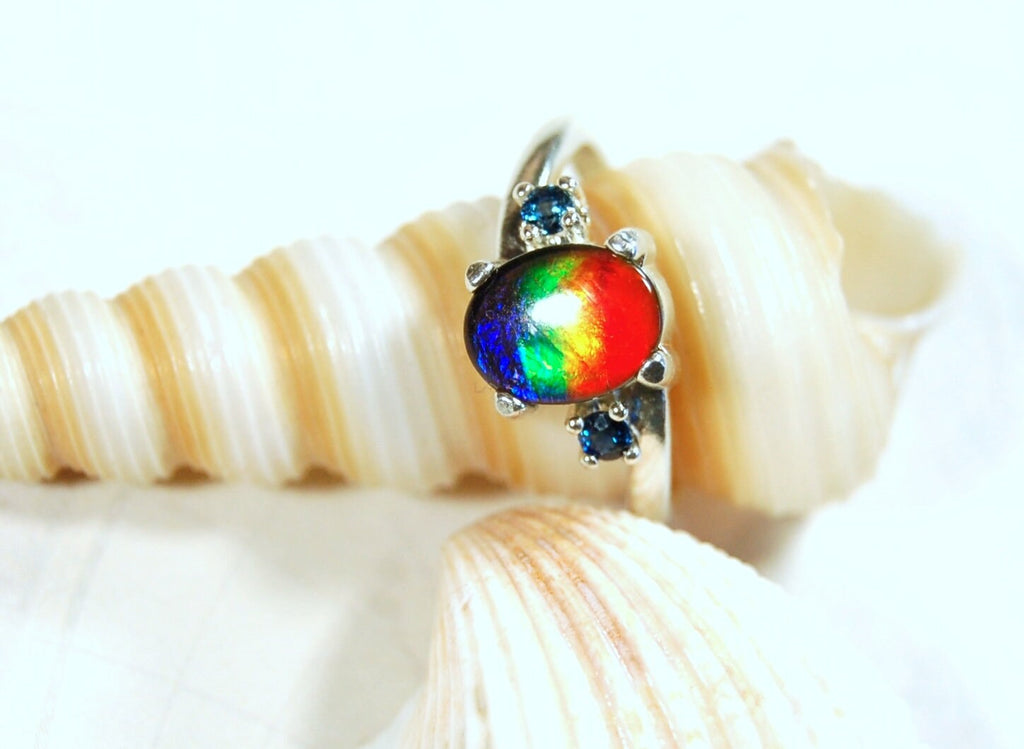 Ammolite Ring with Sapphire side stones.Lovely four color gem.Size 7.-#040314