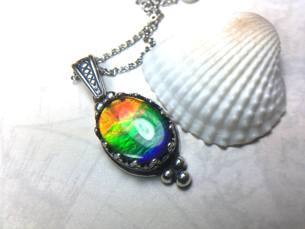 Genuine Ammolite Jewelry Pendant.Rainbow gem.Sterling Silver setting.No import taxes under CUSMA rules.062815