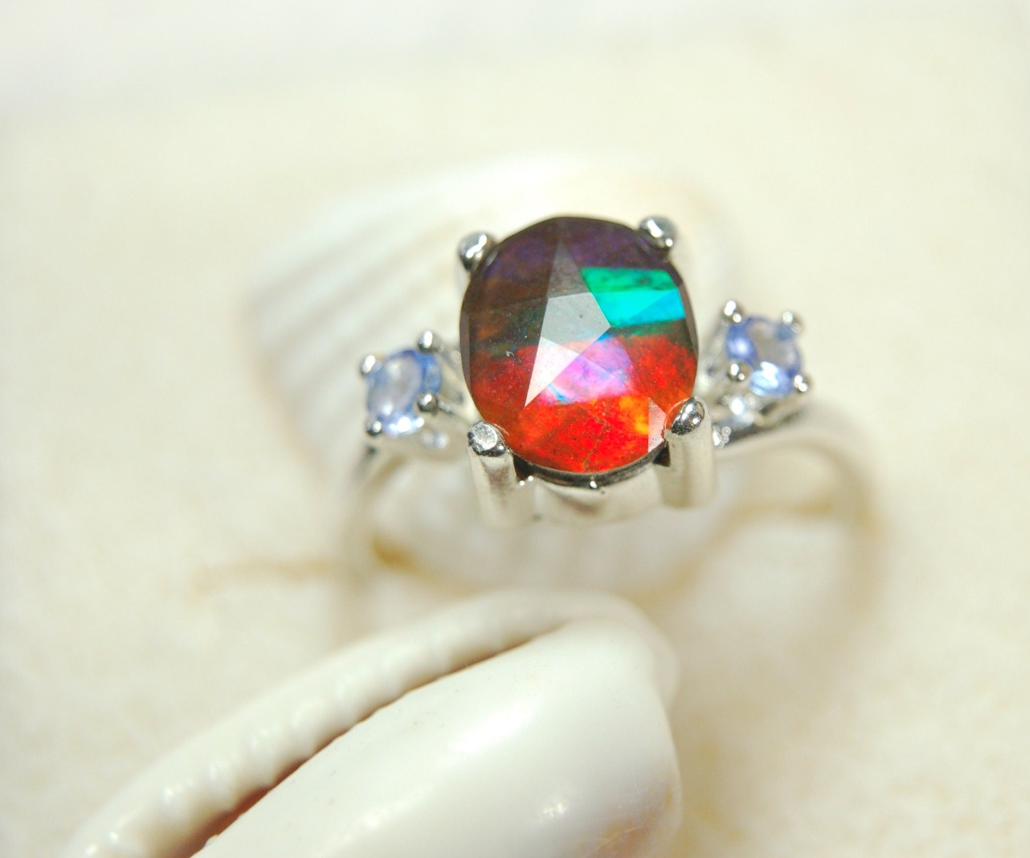 Ammolite Jewelry Ring with Tanzanites.No import taxes under CUSMA rules.022414