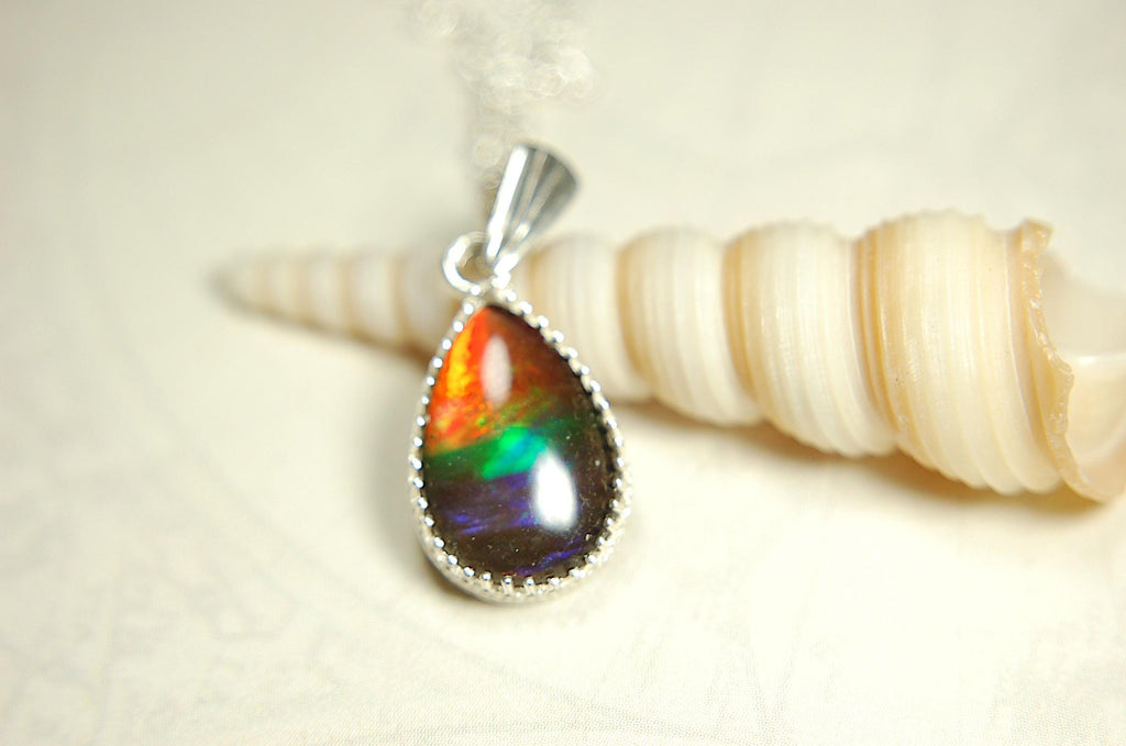 Dainty ammolite pendant.Brilliant color gem.Feminine jewelry.UniqueGift for her.Canadian gemstone.Sterling Silver setting.021126