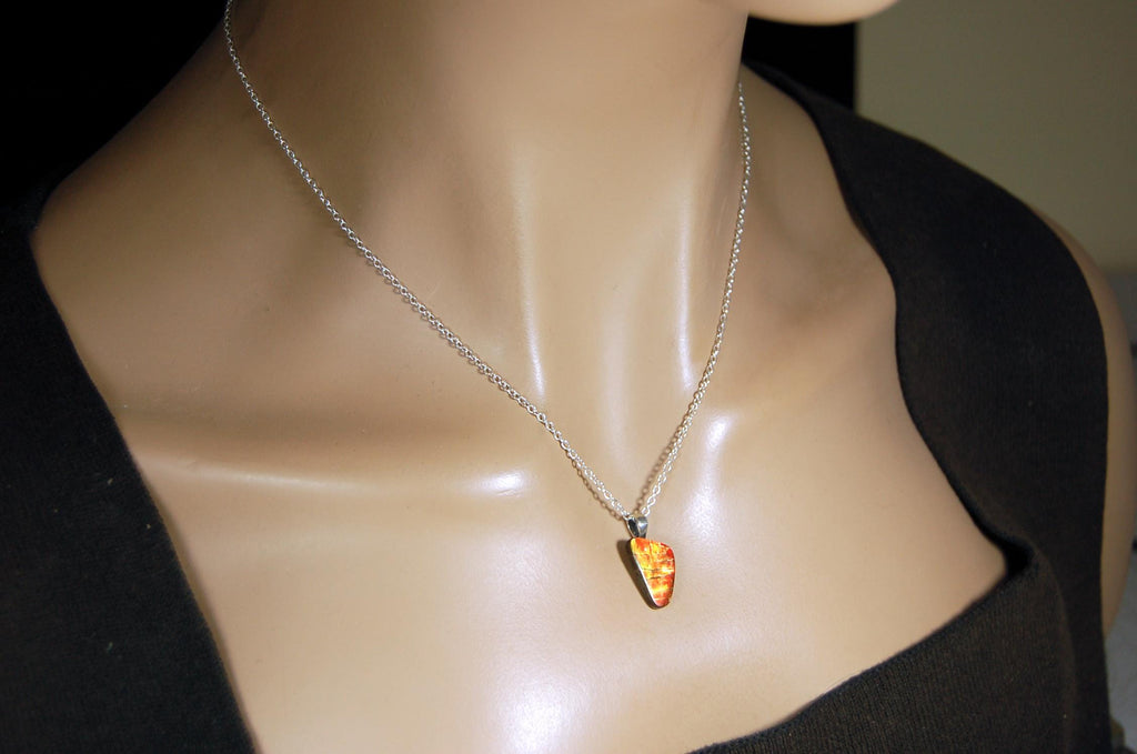 Ammolite Pendant with a gem of fire best appreciated in video.Amazing brilliance and hot colors.A big attention getter.022416