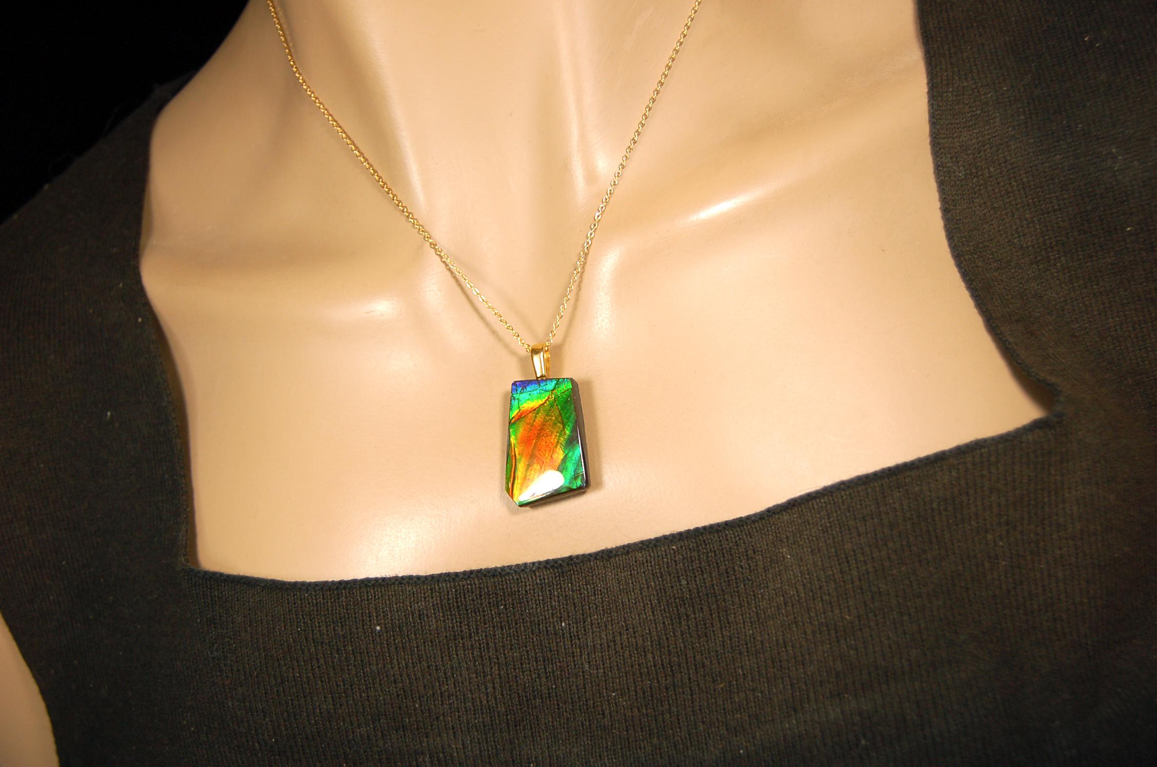 Ammolite pendant.Vivid colors in a high quality all natural cabochon with 14k gold filled bail.Fine fashion jewelry accessory 022516