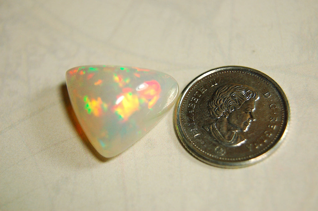 Large genuine natural Opal Cabochon from Ethiopia.11 Carat beauty with many bright colors.Best viewed in video--better in hand.122813