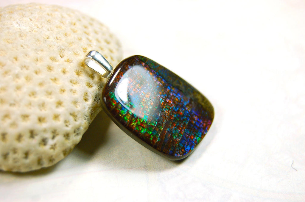 Ammolite Pendant Necklace.RARE Natural gem with brilliant sparks of color on black background.--071815