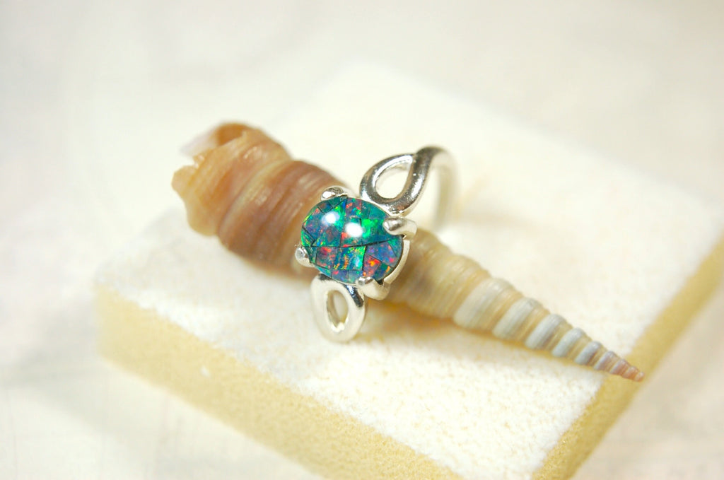 Australian Opal Ring.Gorgeous colors. Set in Sterling Silver.The perfect gift.Size 7 Boho style.