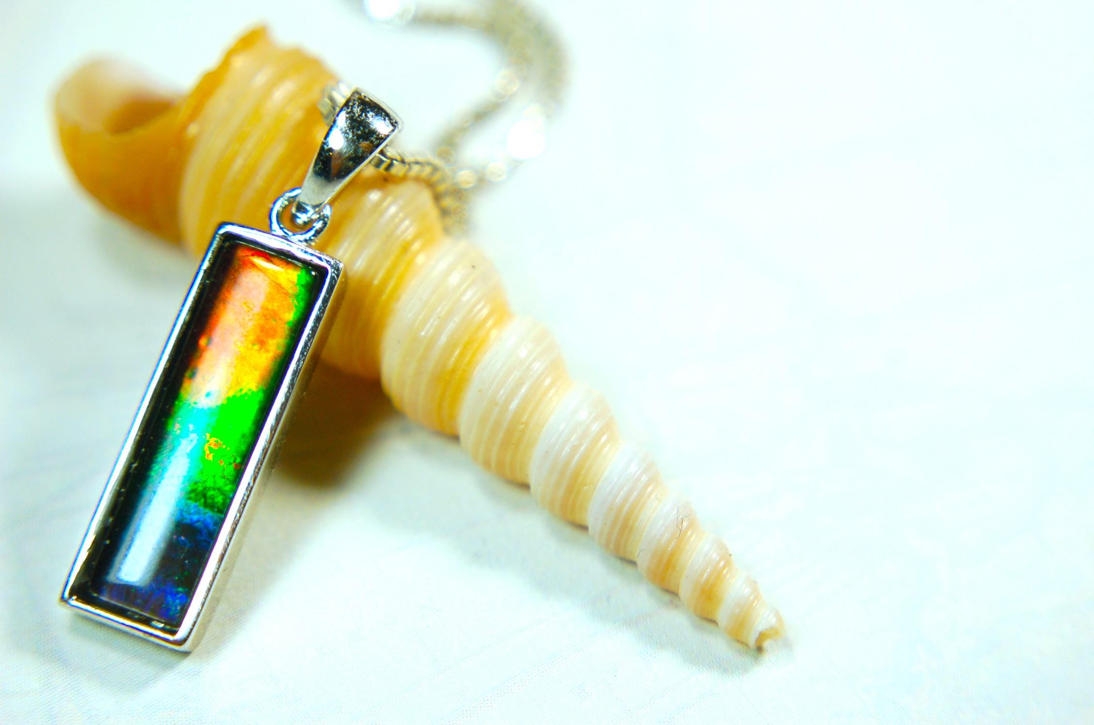 Lovely Ammolite pendant - the perfect gift for someone special.Sterling Silver plated with Rhodium so allergy free.052415