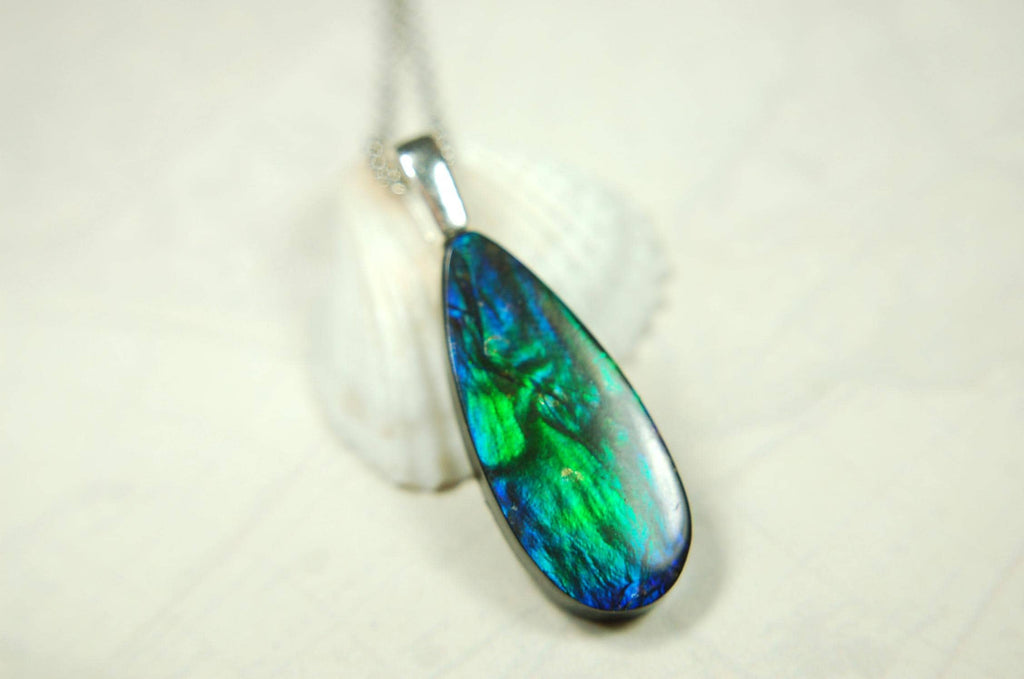 Ammolite Jewelry Pendant.All natural high quality cabochon from Alberta Canada.070715