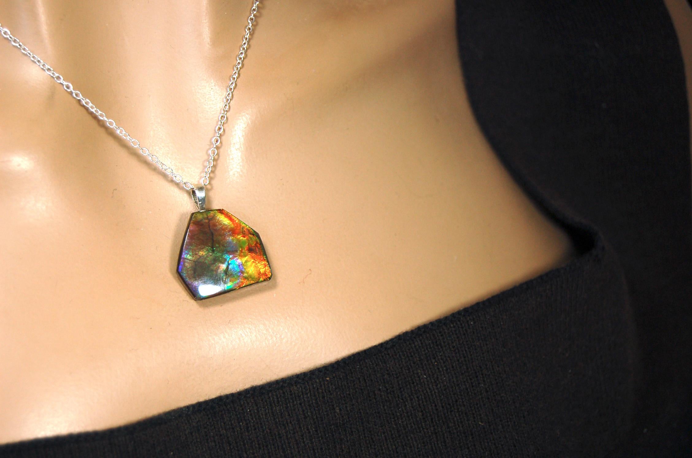 Ammolite pendant.RARE colors.Best seen in video.All natural cabochon from Alberta Canada.Thoughtful gift for her.022716