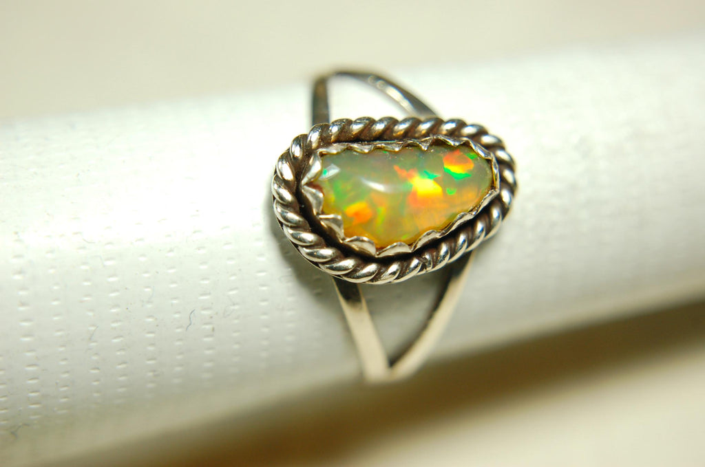 Opal Ring.Genuine untreated Ethiopian Opal.Lovely bright colors when rotated.Size 8.Sterling Silver.053115