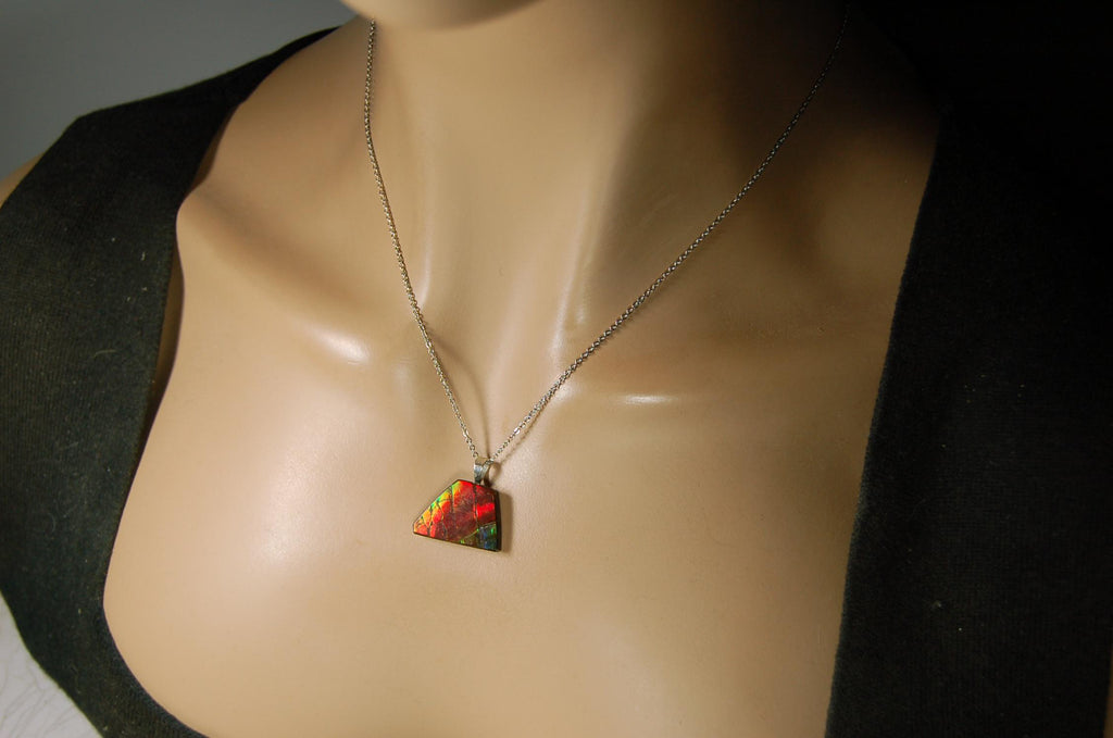 Natural Ammolite pendant with natural cabochon gem mined in Alberta Canada.070915