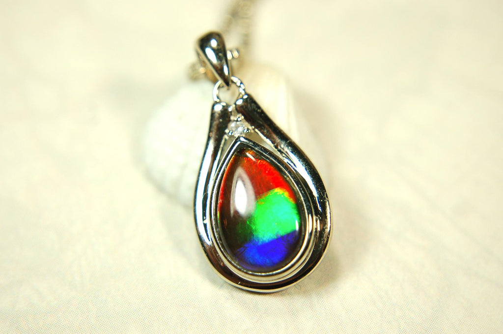 Buy Canadian Ammolite Pendant.Petite but very powerful colors.Perfect gift or gift for wife.Brilliant rainbow colors.Must see video.050429