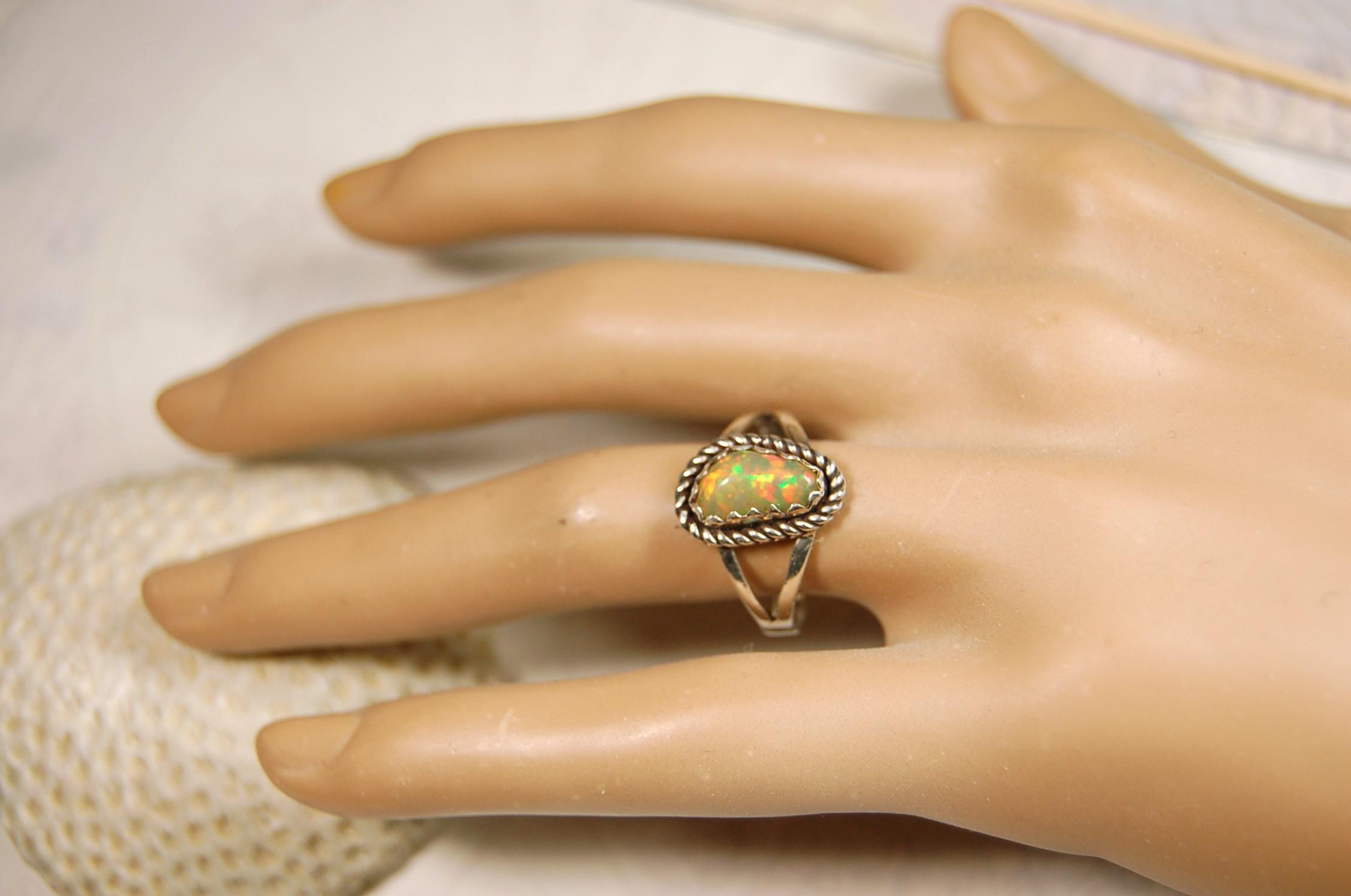 Opal Ring.Genuine untreated Ethiopian Opal.Lovely bright colors when rotated.Size 8.Sterling Silver.053115