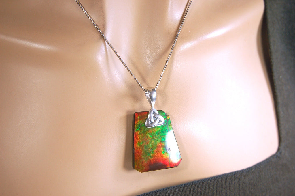 Natural Ammolite Cabochon Pendant necklace with deep rich colors.Heavy sterling silver Celtic Bail.Gift for wife? Must see video.032514