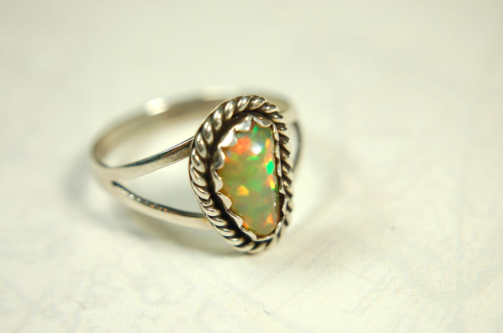 Opal Ring.Genuine untreated Ethiopian Opal.Lovely bright colors when rotated.Size 8.Sterling Silver.053115