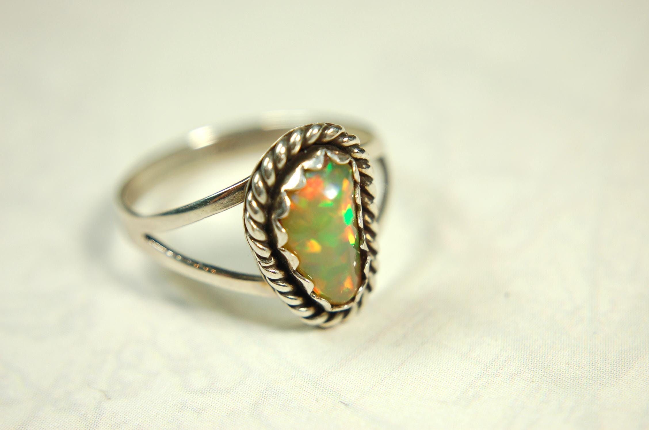 Opal Ring.Genuine untreated Ethiopian Opal.Lovely bright colors when rotated.Size 8.Sterling Silver.053115
