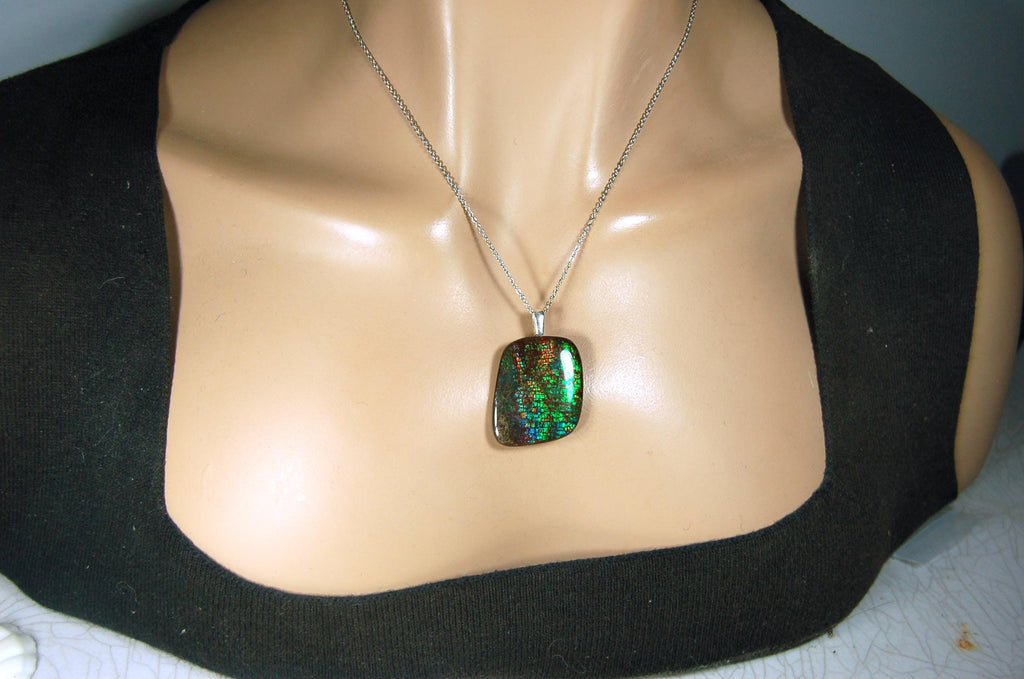 Ammolite Pendant Necklace.RARE Natural gem with brilliant sparks of color on black background.--071815