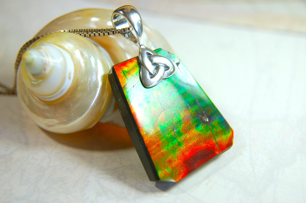Natural Ammolite Cabochon Pendant necklace with deep rich colors.Heavy sterling silver Celtic Bail.Gift for wife? Must see video.032514