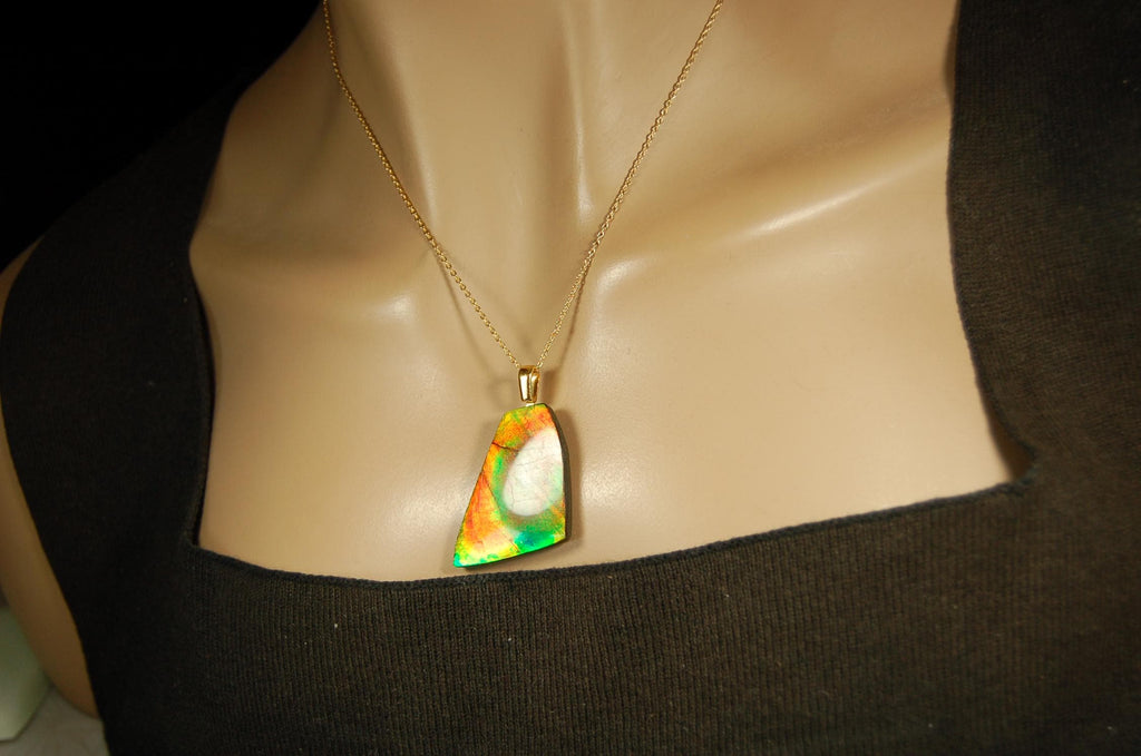 Ammolite Pendant.Natural Cabochon with strong color changing abilities.14kGF Gold bail.Elevate your style.030716