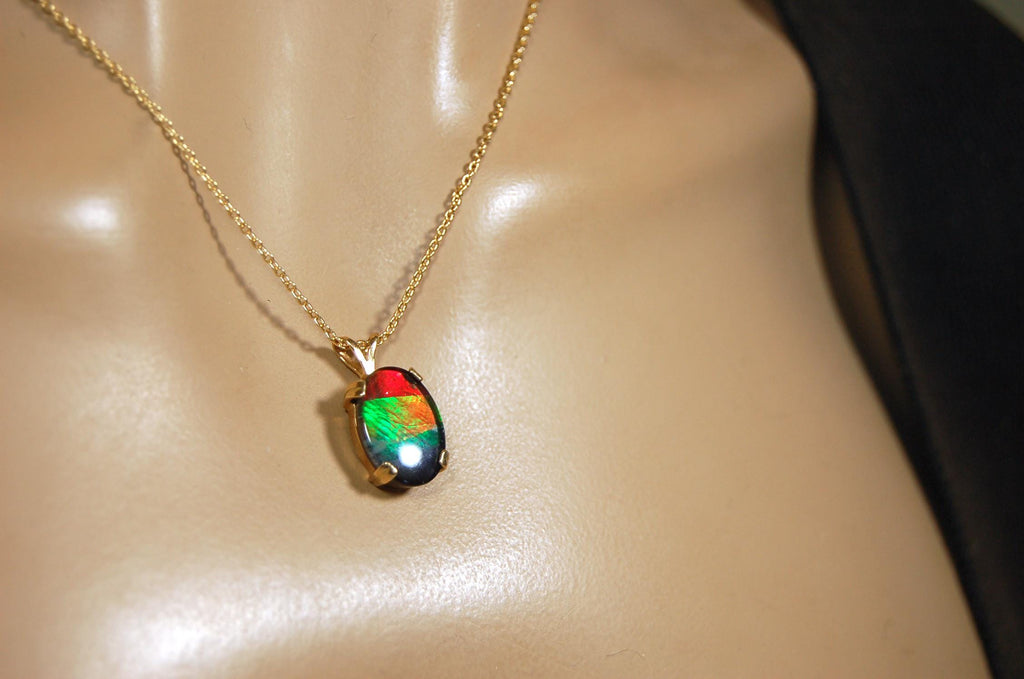 Ammolite necklace pendant in solid 10k yellow gold.A gift your wife will treasure.Brilliant color changer. 071601