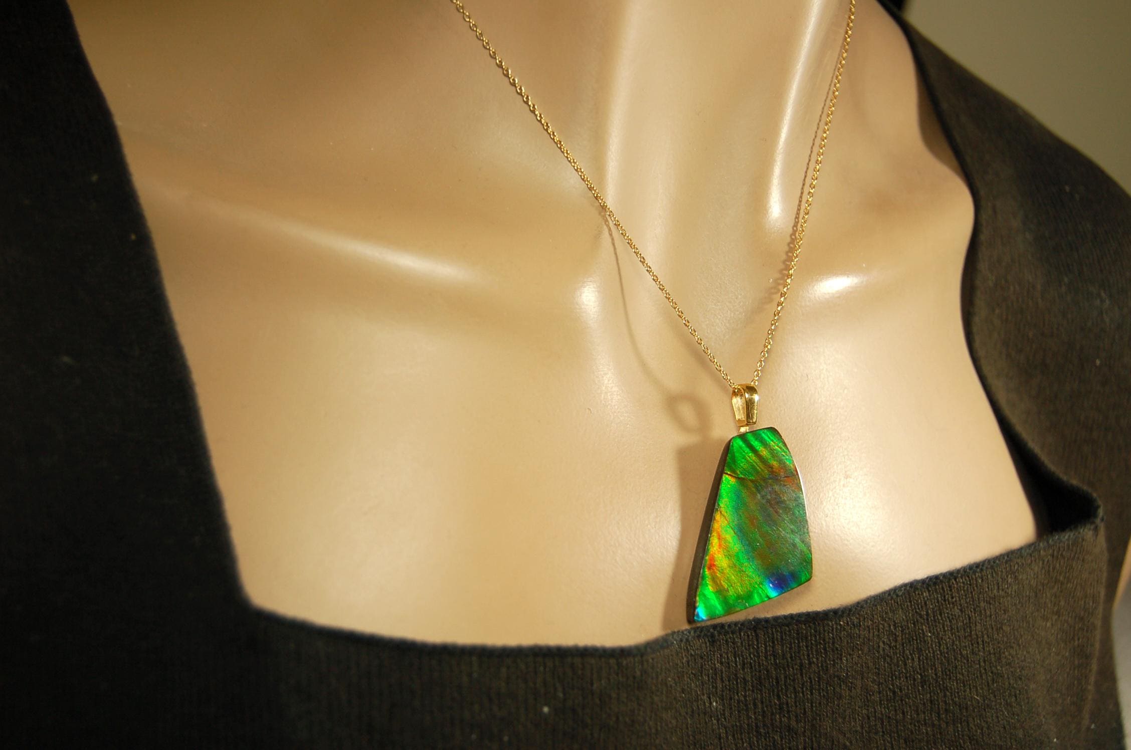 Ammolite Pendant.Natural Cabochon with strong color changing abilities.14kGF Gold bail.Elevate your style.030716