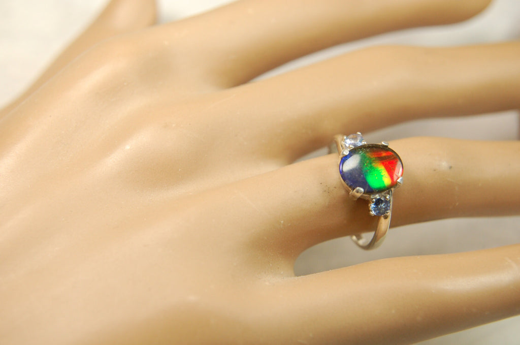Ammolite Ring with brilliant colors and Tanzanite side stones.Size 7 #120223