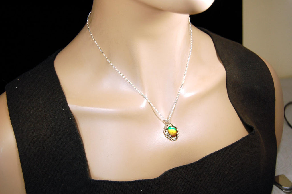 Ammolite pendant petite but powerful impact.Rich Sunset colors.Memorable gift.Fashion accessory.Rare jewelry.022216