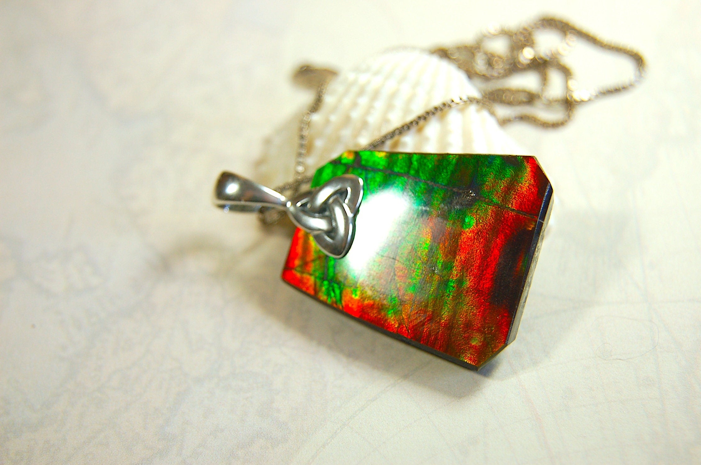 Natural Ammolite Cabochon Pendant necklace with deep rich colors.Heavy sterling silver Celtic Bail.Gift for wife? Must see video.032514
