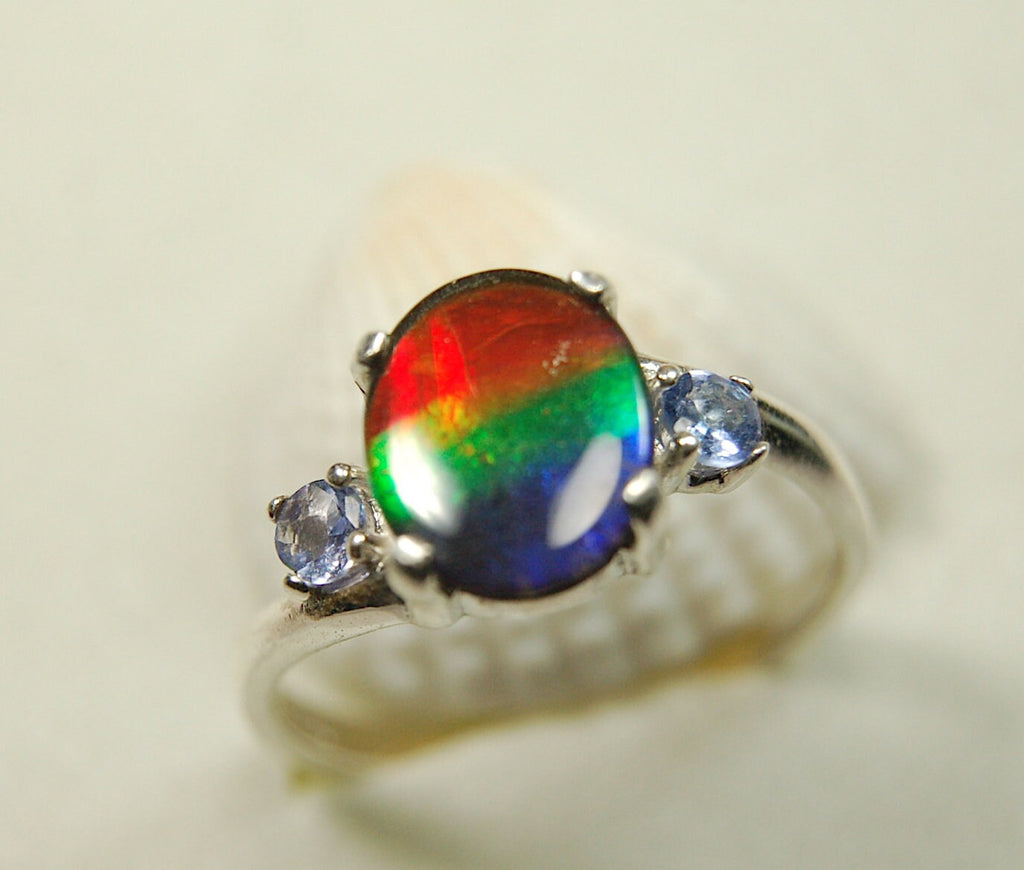 Ammolite Ring with brilliant colors and Tanzanite side stones.Size 7 #120223
