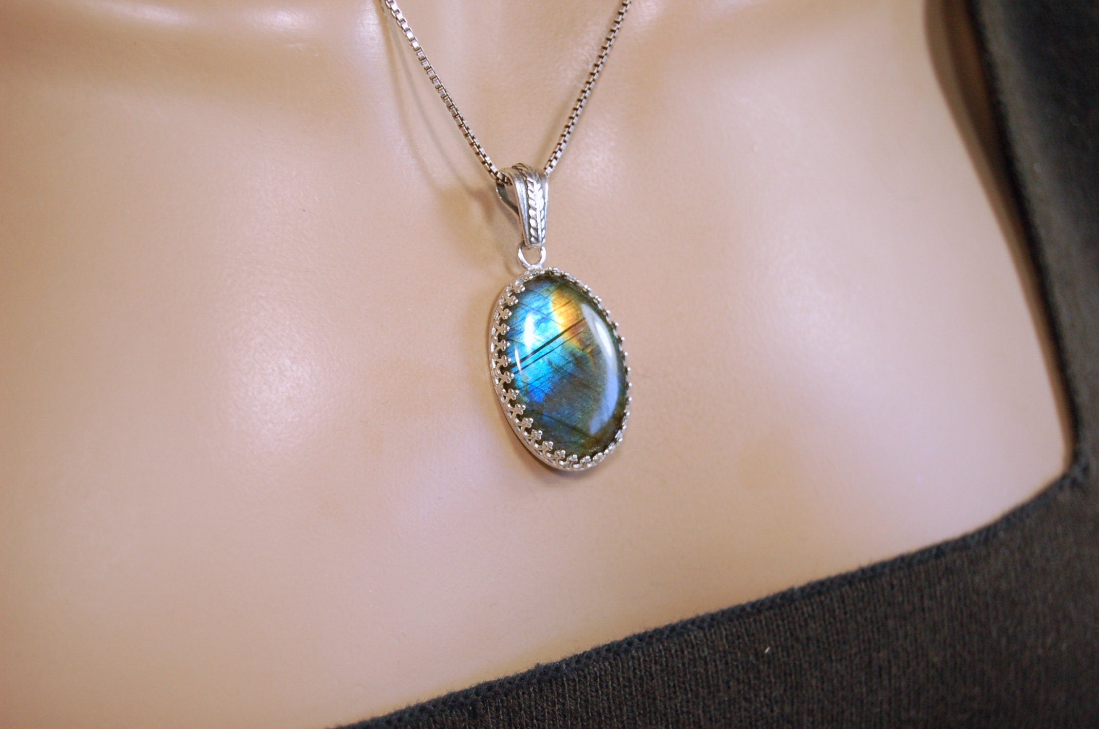 High Quality Canadian Labradorite Pendant.Lots of colored flash with blue and gold showing.The perfect gift.Unisex.033024